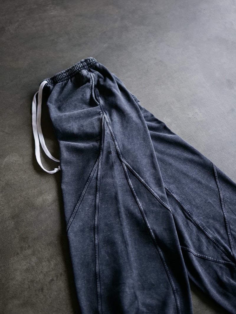 Goji Longevity heavyweight acid-washed black sweatpants — close side profile